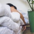 Person sleeping in bed